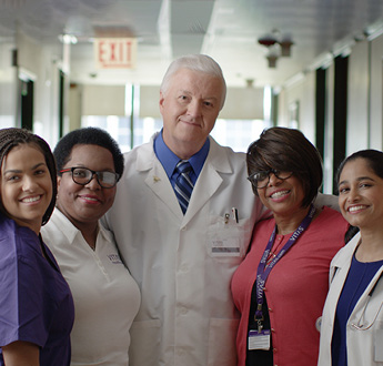 A group of VITAS team members including a nurse, physician, social worker and sales representative