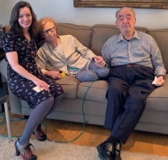 Benjamin Z. sits with his wife and a VITAS chaplain